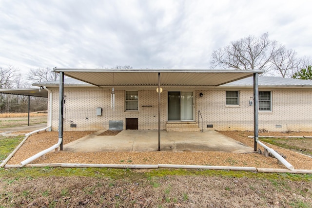 back of property featuring a carport