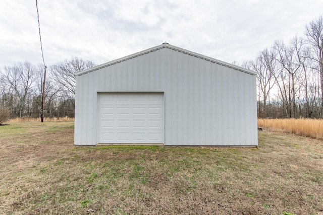 garage featuring a yard