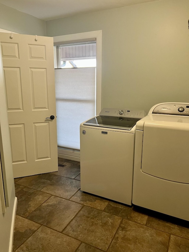 laundry area with independent washer and dryer