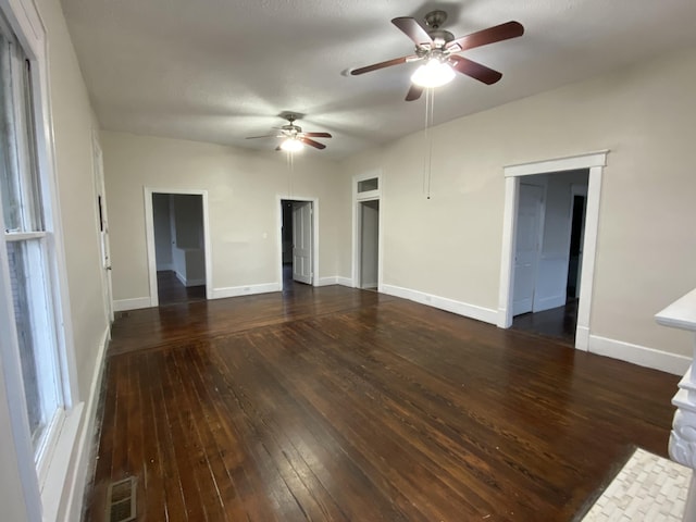 empty room with dark hardwood / wood-style floors