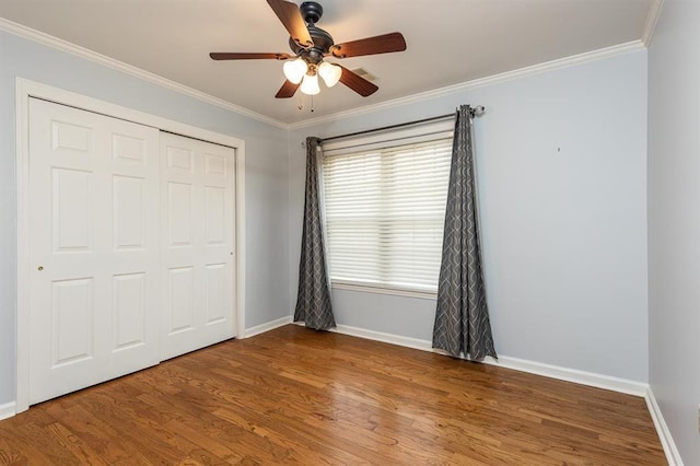 2958 Millers Pond Dr, Memphis, TN 38119 - unfurnished bedroom featuring crown molding, hardwood / wood-style floors, ceiling fan, and a closet