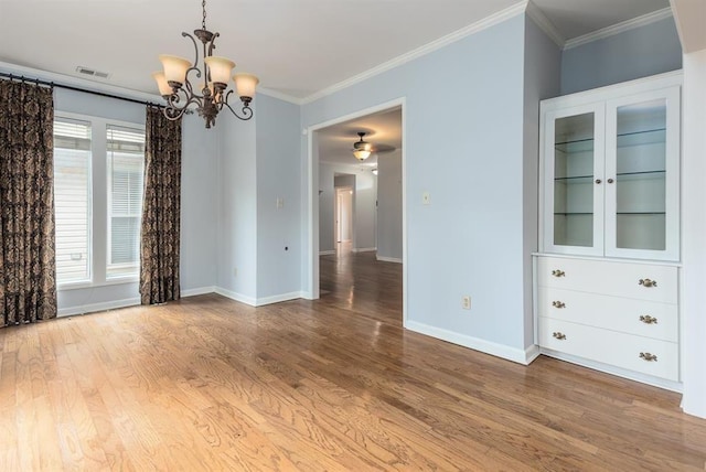 2958 Millers Pond Dr, Memphis, TN 38119 - unfurnished room with hardwood / wood-style flooring, crown molding, and plenty of natural light