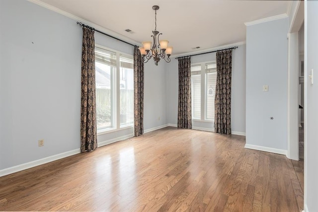 2958 Millers Pond Dr, Memphis, TN 38119 - spare room with an inviting chandelier, ornamental molding, and wood-type flooring