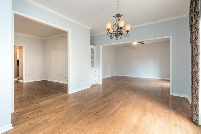 2958 Millers Pond Dr, Memphis, TN 38119 - unfurnished room featuring hardwood / wood-style flooring, crown molding, and ceiling fan with notable chandelier