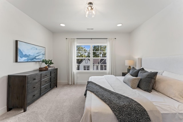 bedroom with light carpet