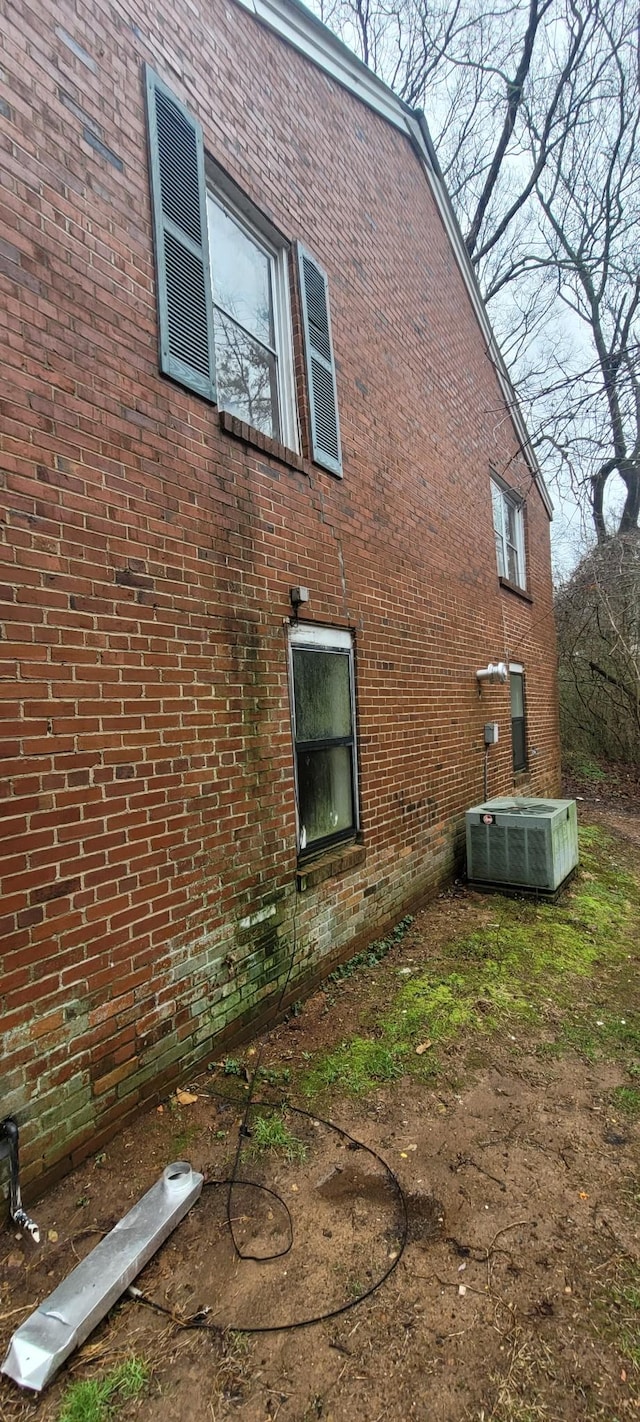 view of side of home featuring central air condition unit