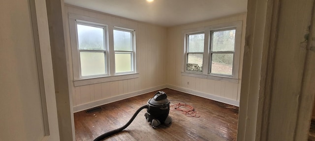 unfurnished room featuring dark wood-type flooring