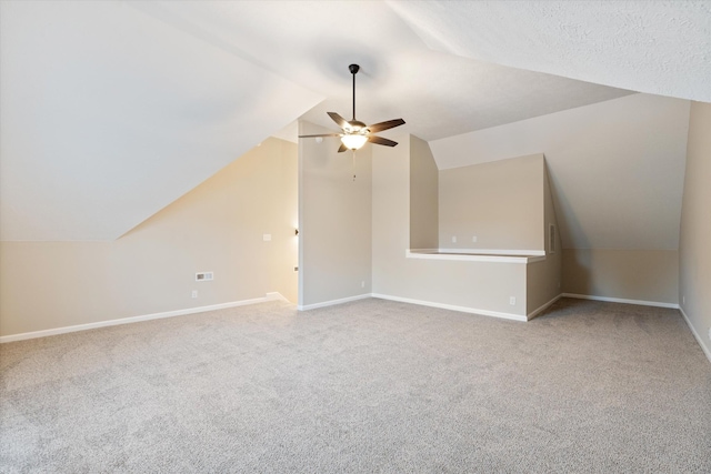 bonus room featuring ceiling fan, lofted ceiling, and carpet flooring