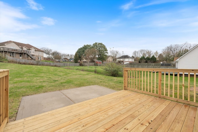 wooden deck featuring a yard