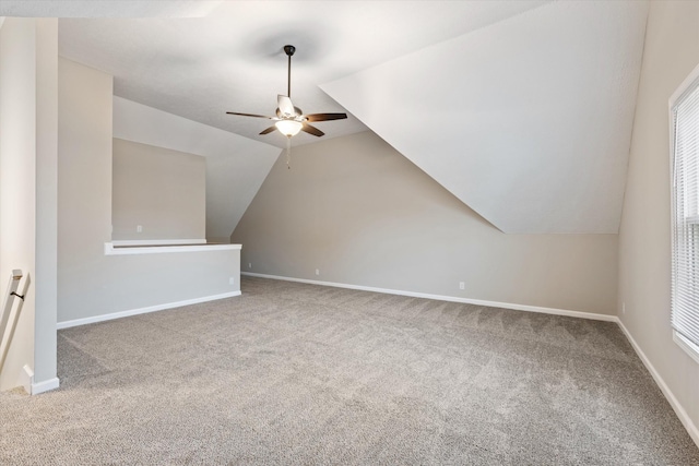 additional living space featuring ceiling fan, vaulted ceiling, and carpet