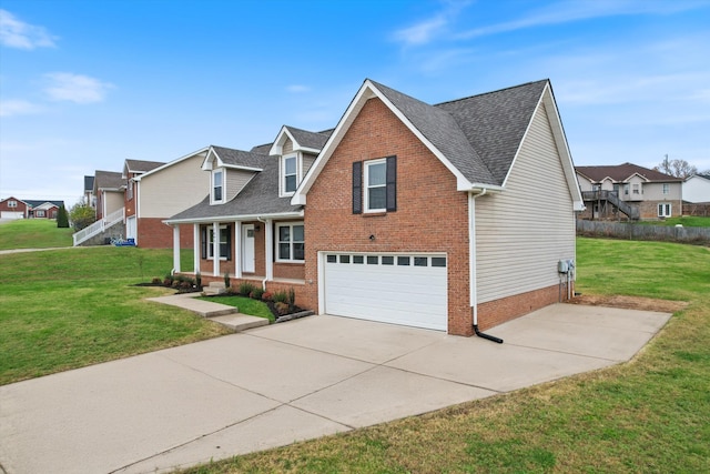 view of front of property with a garage, covered porch, and a front yard