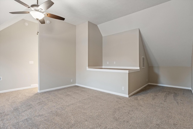 bonus room with ceiling fan, vaulted ceiling, and carpet