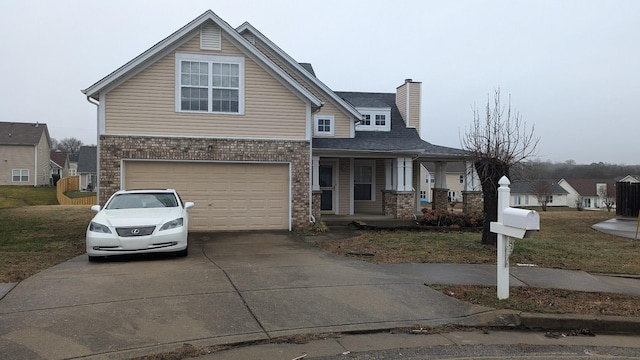 view of front of property featuring a garage and covered porch