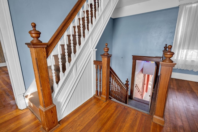 stairway featuring hardwood / wood-style floors