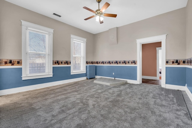 empty room with carpet and ceiling fan