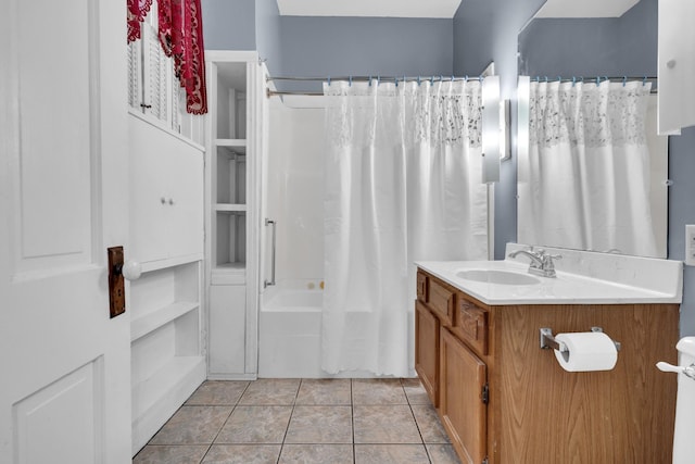 bathroom with tile patterned floors, shower / tub combo, and vanity