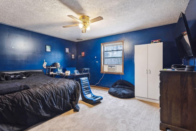 carpeted bedroom featuring cooling unit, ceiling fan, and a textured ceiling