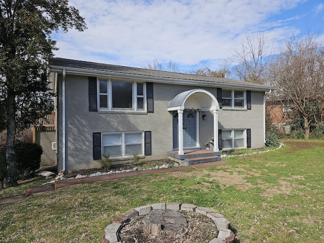 raised ranch featuring a front yard