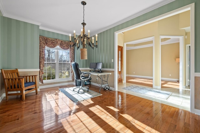 office featuring an inviting chandelier, hardwood / wood-style flooring, and ornamental molding