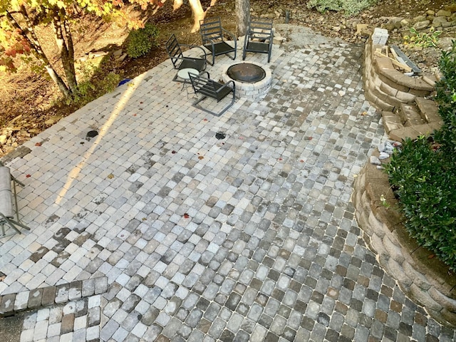 view of patio / terrace with an outdoor fire pit