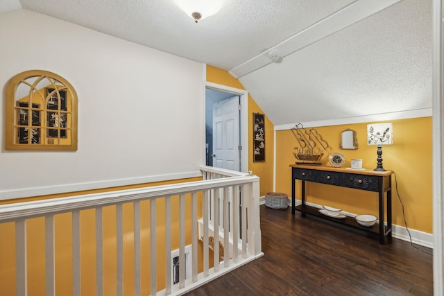 479 Elora Rd, Elora, TN 37328 - hallway featuring lofted ceiling, wood finished floors, a textured ceiling, and baseboards