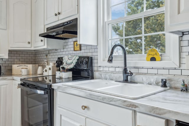 479 Elora Rd, Elora, TN 37328 - kitchen with black electric range oven, under cabinet range hood, a sink, white cabinetry, and decorative backsplash