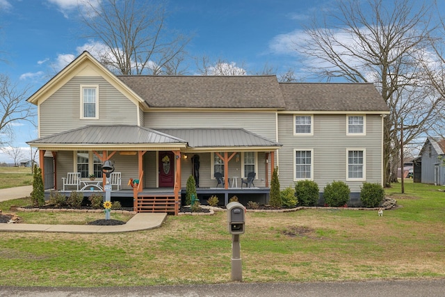 view of front of house with a porch and a front yard