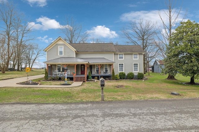 view of front of house with a porch and a front lawn