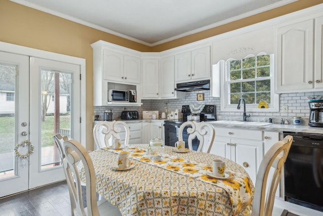 479 Elora Rd, Elora, TN 37328 - kitchen featuring dishwasher, range with electric stovetop, under cabinet range hood, a sink, and white cabinets