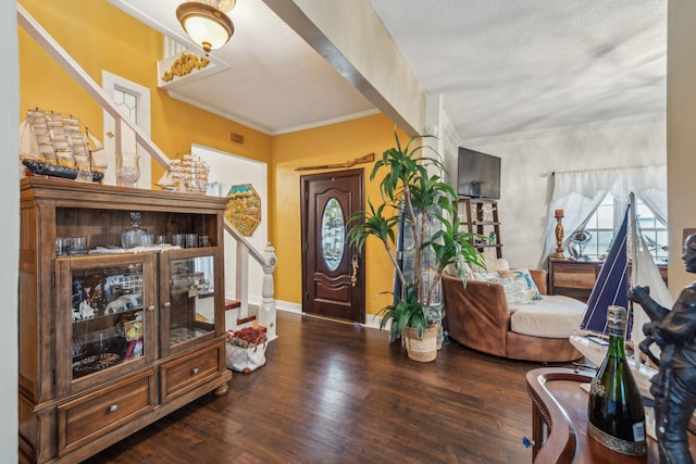 479 Elora Rd, Elora, TN 37328 - entryway featuring wood finished floors, stairs, baseboards, ornamental molding, and a textured ceiling