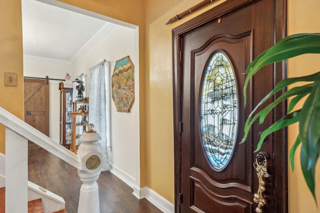 479 Elora Rd, Elora, TN 37328 - foyer featuring crown molding, baseboards, dark wood-style floors, and a barn door