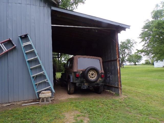 479 Elora Rd, Elora, TN 37328 - view of parking / parking lot featuring a carport