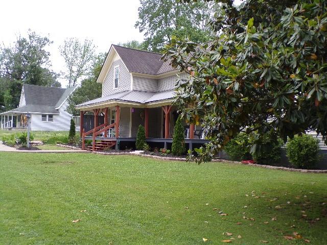479 Elora Rd, Elora, TN 37328 - farmhouse-style home with covered porch and a front lawn