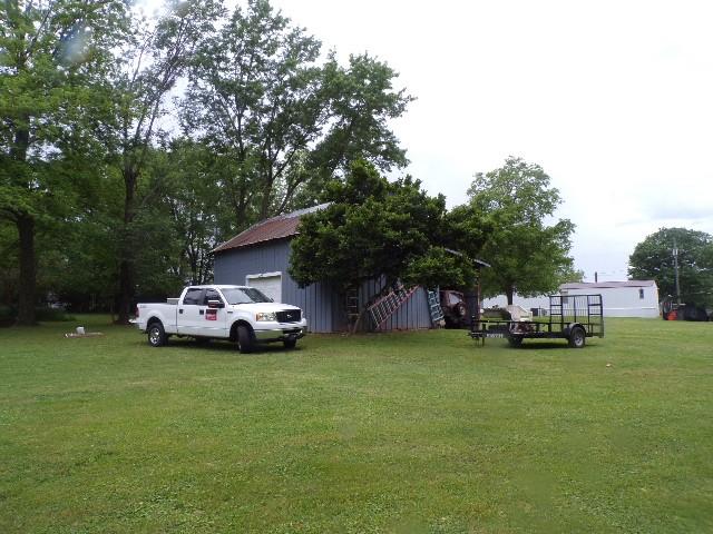 479 Elora Rd, Elora, TN 37328 - view of green lawn featuring an outbuilding and a garage