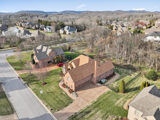 birds eye view of property with a mountain view and a residential view