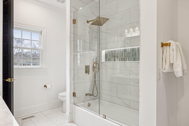 full bath with baseboards, visible vents, toilet, shower / bath combination with glass door, and ornamental molding