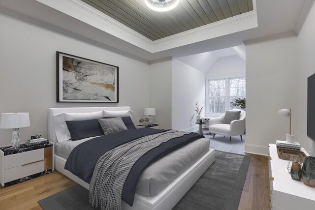 bedroom with a raised ceiling, ornamental molding, wood ceiling, wood finished floors, and baseboards