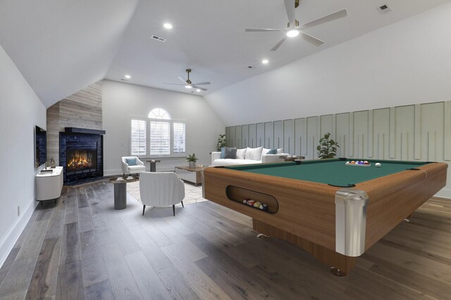 game room featuring dark wood-style floors, visible vents, and a large fireplace