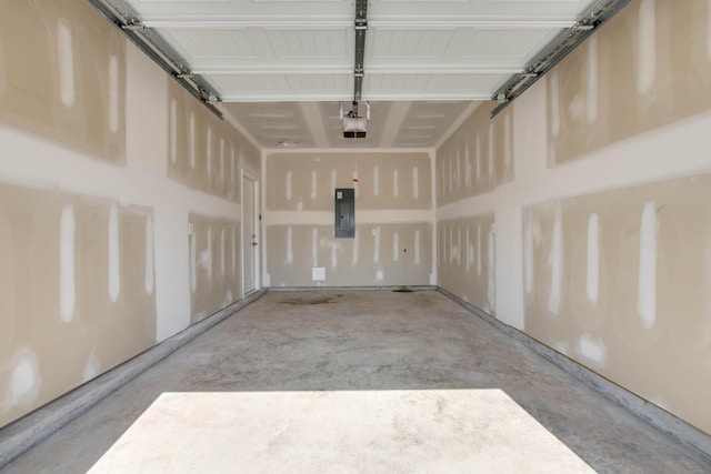 garage featuring a garage door opener and electric panel