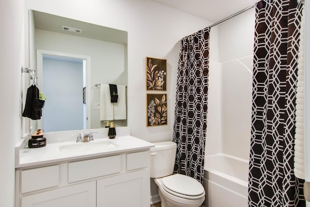 full bathroom with vanity, toilet, and shower / bath combo with shower curtain