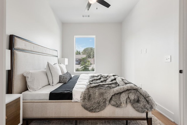 bedroom featuring wood-type flooring and ceiling fan