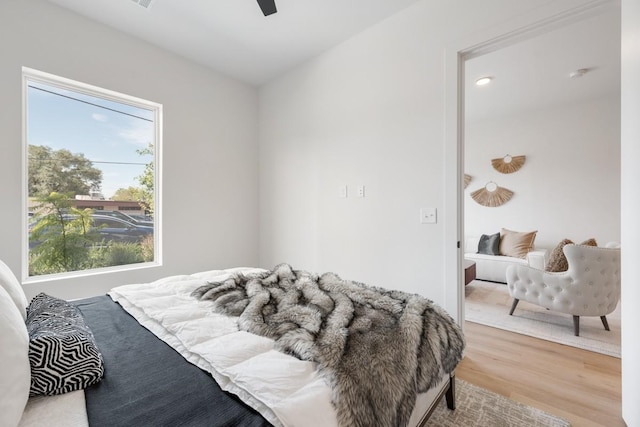 bedroom featuring wood-type flooring and ceiling fan