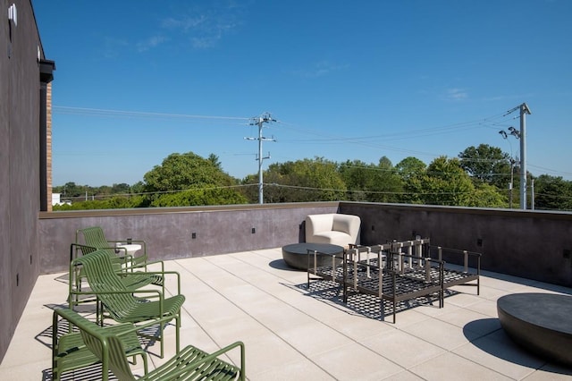 view of patio with a fire pit