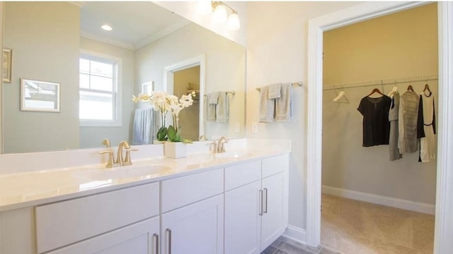 bathroom with crown molding and vanity