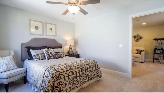 bedroom featuring light carpet and ceiling fan