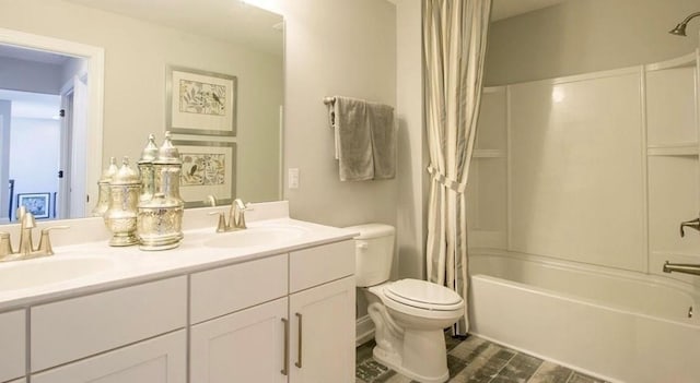 full bathroom with vanity, wood-type flooring, toilet, and shower / bath combo with shower curtain