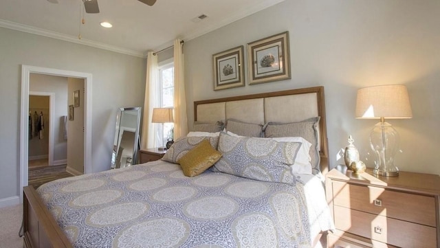 bedroom with ornamental molding, carpet floors, and ceiling fan