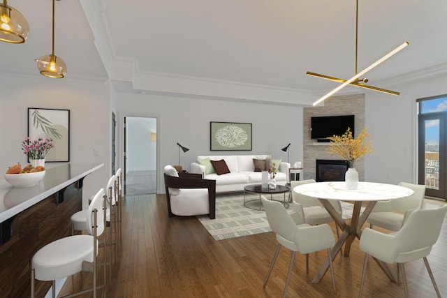 dining area featuring crown molding, dark hardwood / wood-style floors, and a fireplace