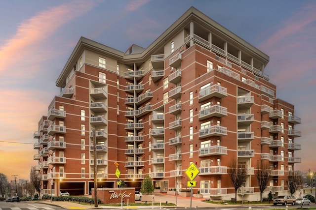 view of outdoor building at dusk