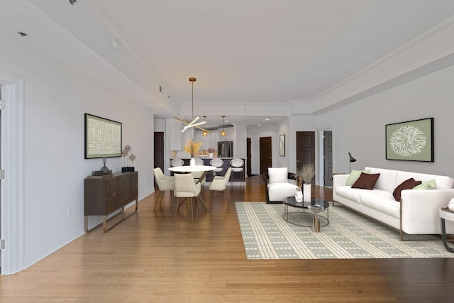 living room featuring hardwood / wood-style floors and ornamental molding